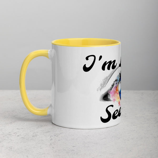 a coffee mug sitting on a table next to a coffee mug 